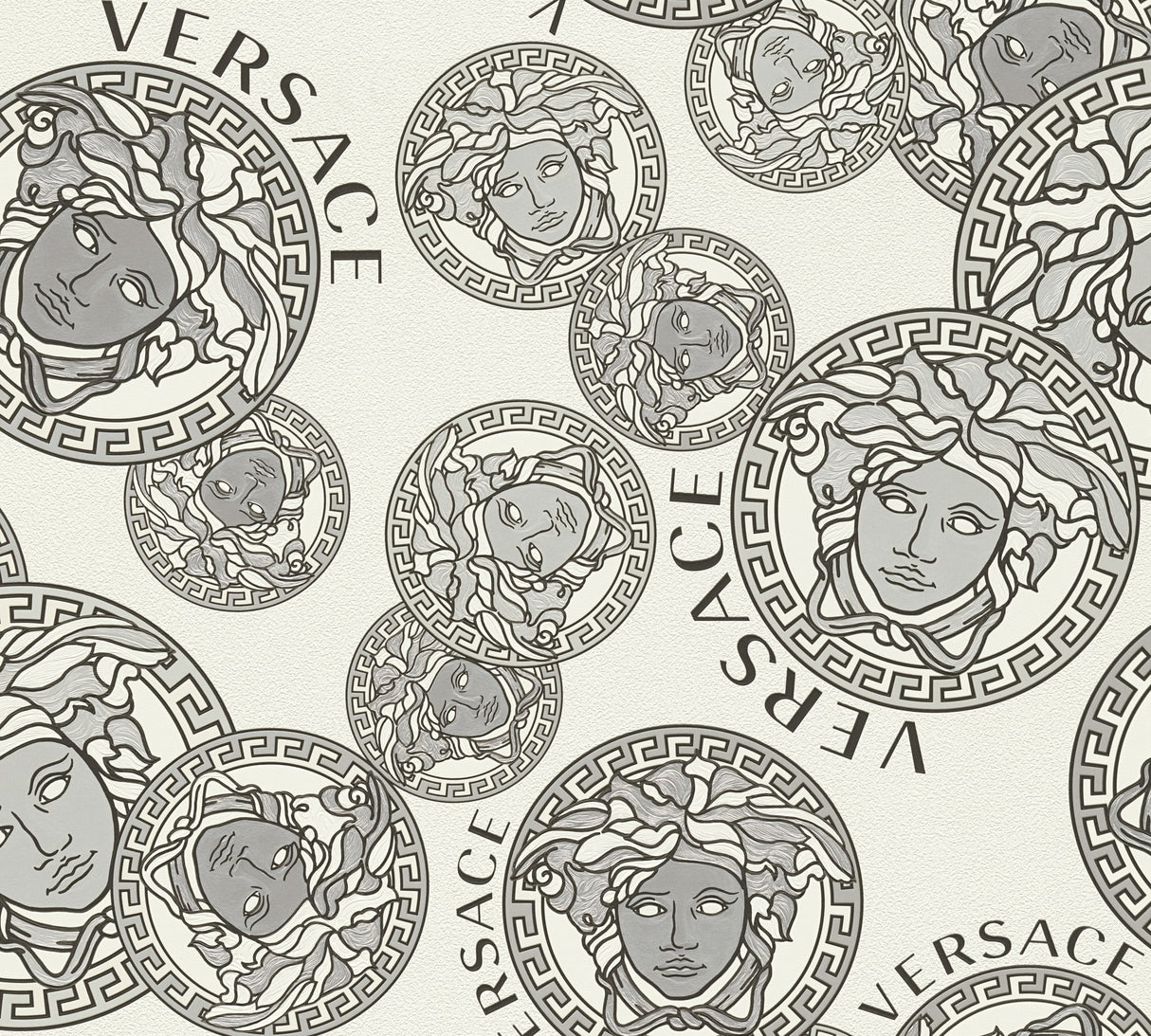 Versace Dynasty wallpaper in Snowbound with grey Medusa medallions and Versace lettering on an off-white satin vinyl ground.