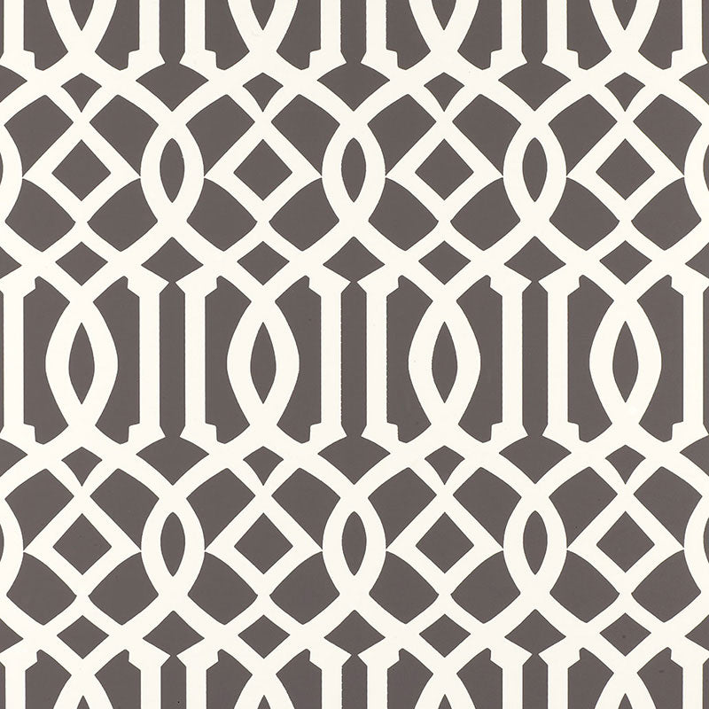 Imperial Trellis Charcoal by Kelly Wearstler for Schumacher - iconic geometric trellis wallpaper in charcoal and white, shown in bedroom and bathroom interiors.