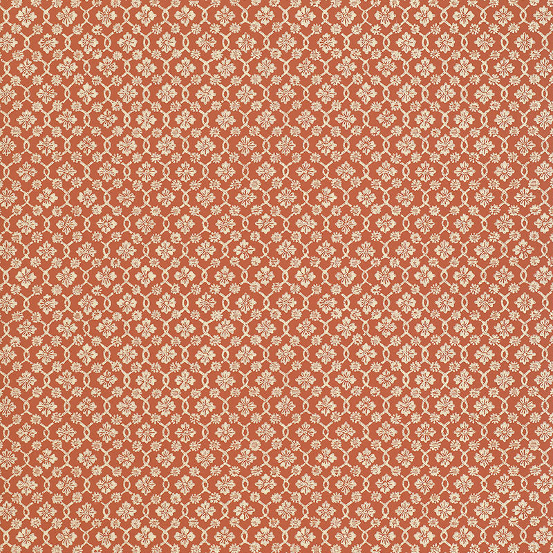 Harbury Trellis wallpaper in coral by Schumacher, featuring a delicate floral and lattice pattern.