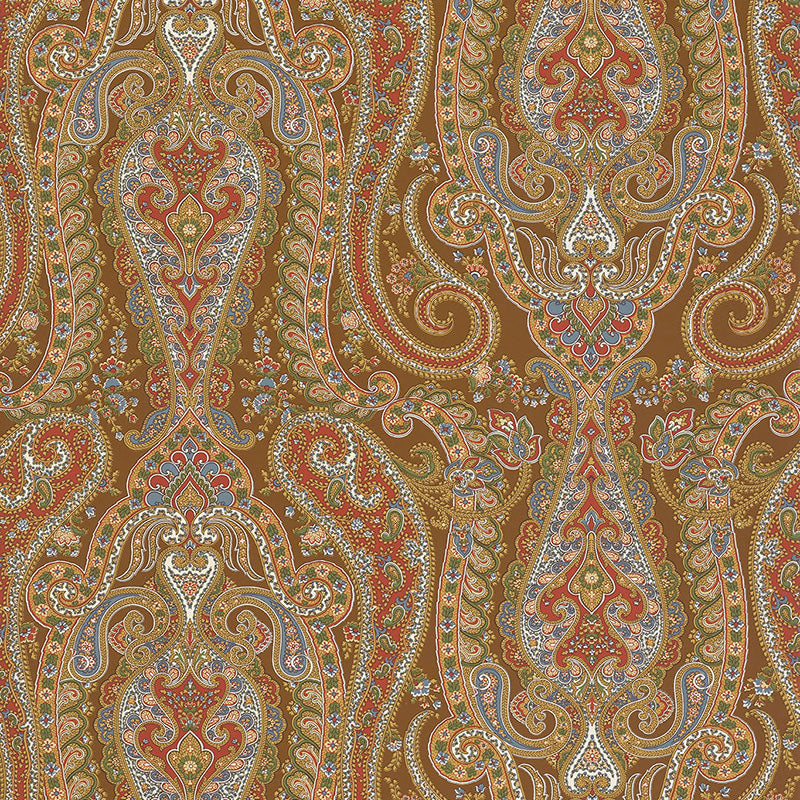 ISABELLA PAISLEY wallpaper in Mink by Schumacher. Ornate paisley pattern in brown, red, blue, and gold tones.