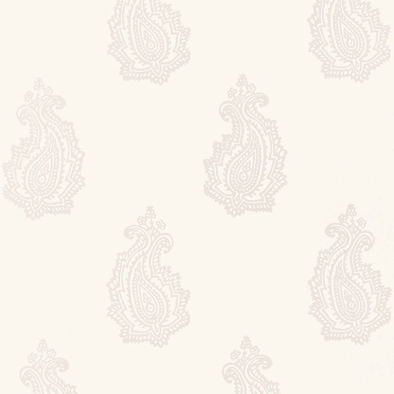 MADRAS PAISLEY wallpaper in Oyster by Schumacher, featuring a hand-screened paisley pattern in a neutral colorway, shown in a bathroom interior.