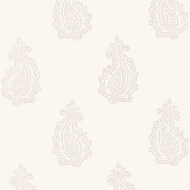 MADRAS PAISLEY wallpaper in Oyster by Schumacher, featuring a hand-screened paisley pattern in a neutral colorway, shown in a bathroom interior.
