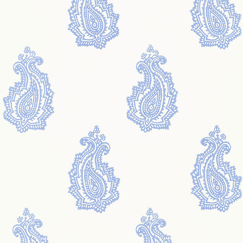 Madras Paisley Delft blue and white paisley wallpaper by Schumacher, shown in a bathroom interior and as a pattern close-up.