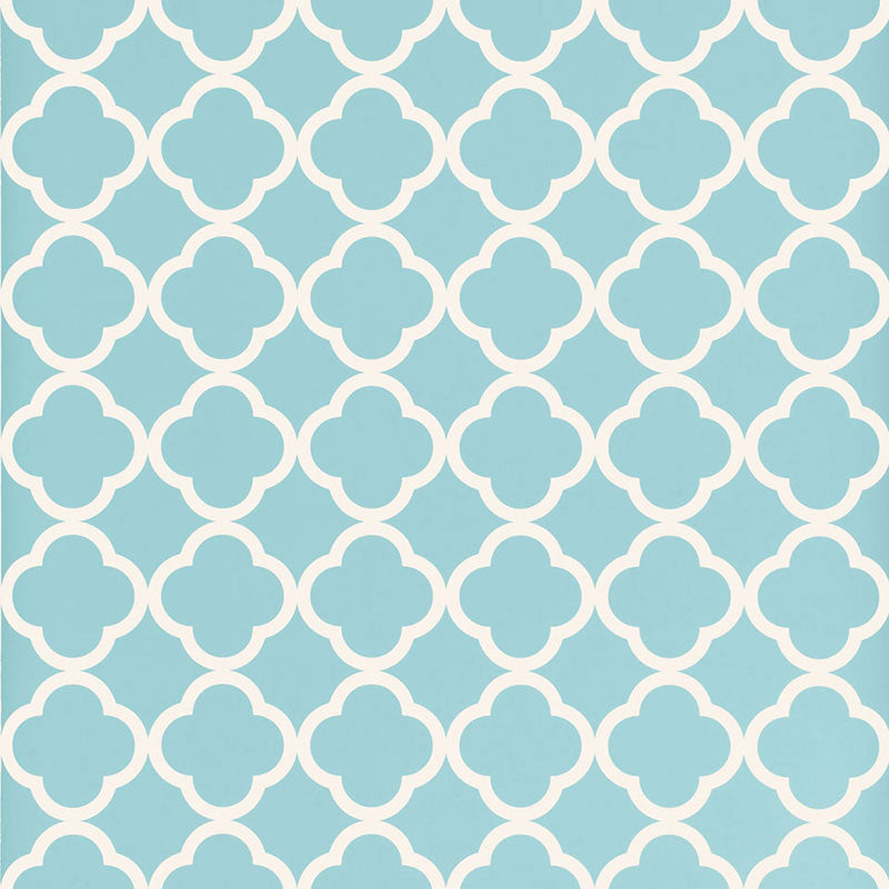 Moroccan-inspired geometric wallpaper in azure blue and white by Schumacher