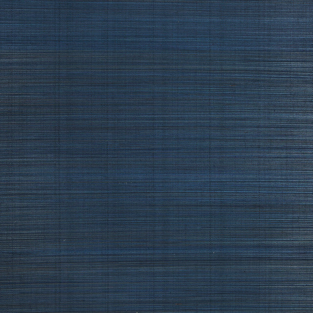 Zen Bamboo Ultramarine wallpaper by Schumacher shown as a textured blue wallcovering and installed in a modern bathroom setting.