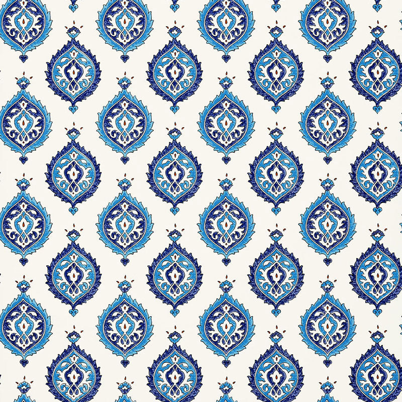 Samovar Peacock wallpaper by Schumacher, featuring a blue and white medallion pattern in a bathroom setting.