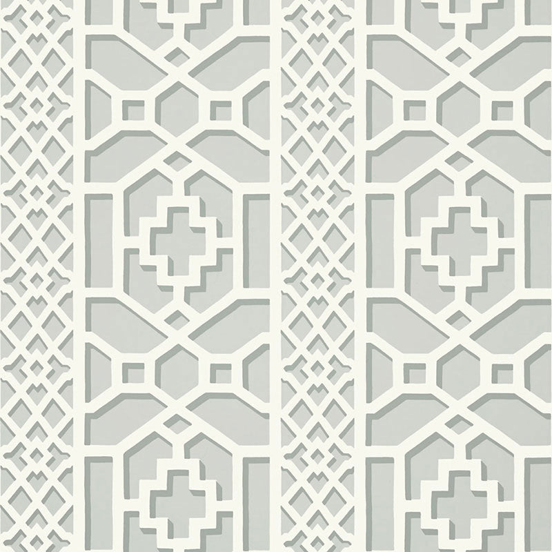 Zanzibar Trellis wallpaper in Cloud by Schumacher features a geometric fretwork trellis pattern inspired by Elsie de Wolfe, shown in soft neutral tones.