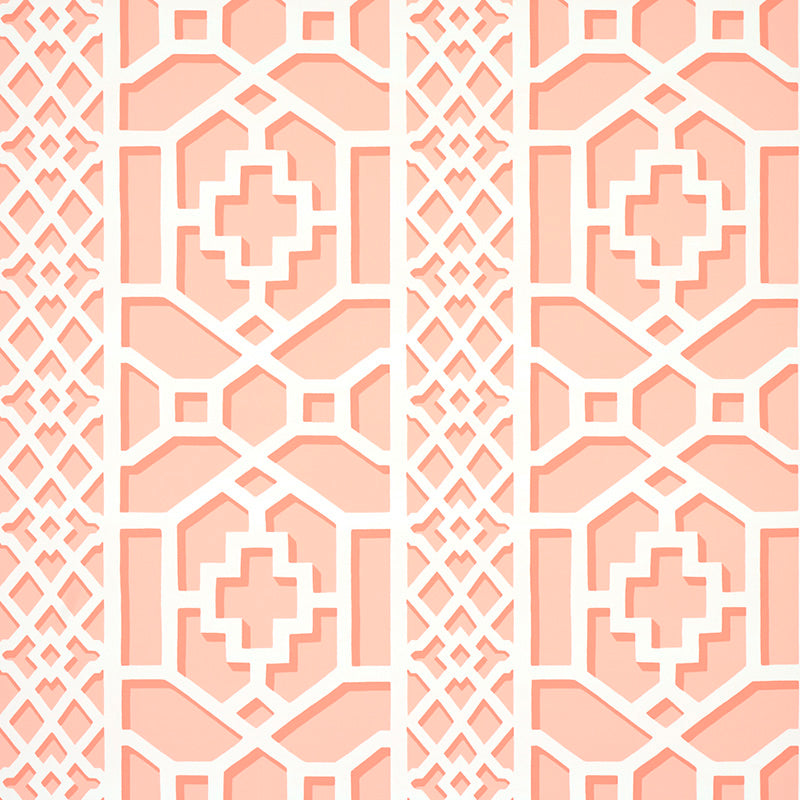 Zanzibar Trellis wallpaper in coral by Schumacher, featuring a bold geometric fretwork pattern inspired by Elsie de Wolfe's trellised rooms.