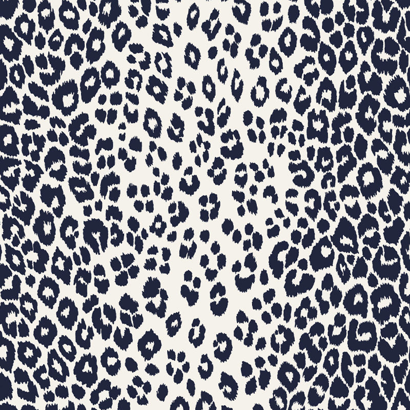 Iconic Leopard Ink wallpaper by Schumacher featuring a bold animal print pattern in deep blue and white.