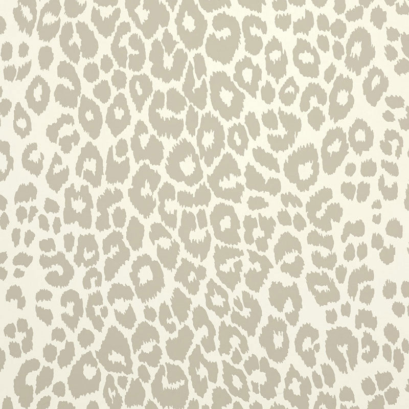 Iconic Leopard wallpaper in Linen by Schumacher, featuring a classic animal print pattern in neutral tones, shown in styled interior settings.