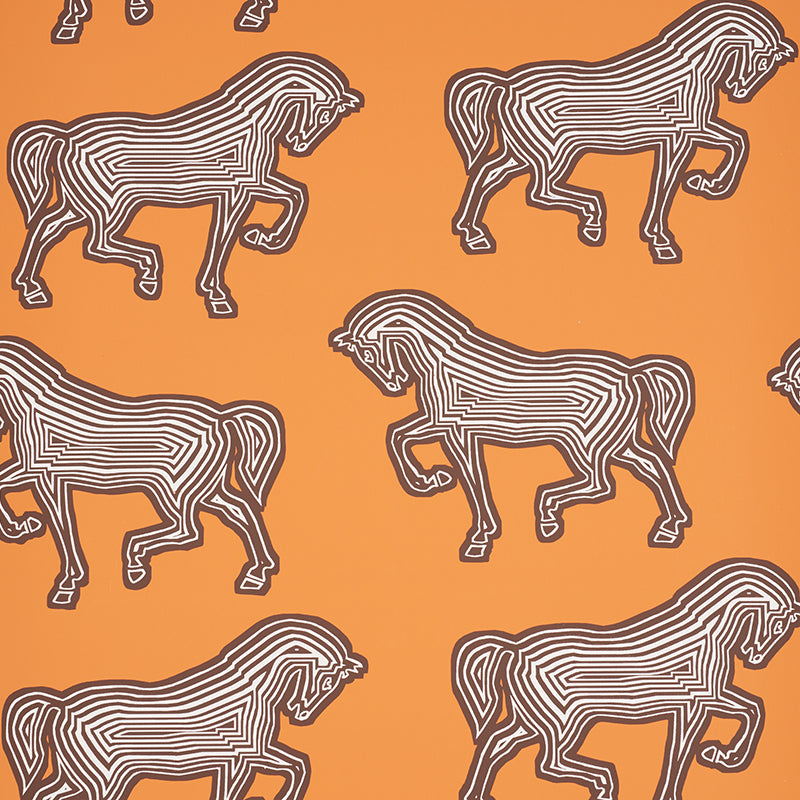 FAUBOURG wallpaper in orange by Schumacher featuring a bold, graphic horse pattern on a vibrant background, shown in a styled interior and close-up views.
