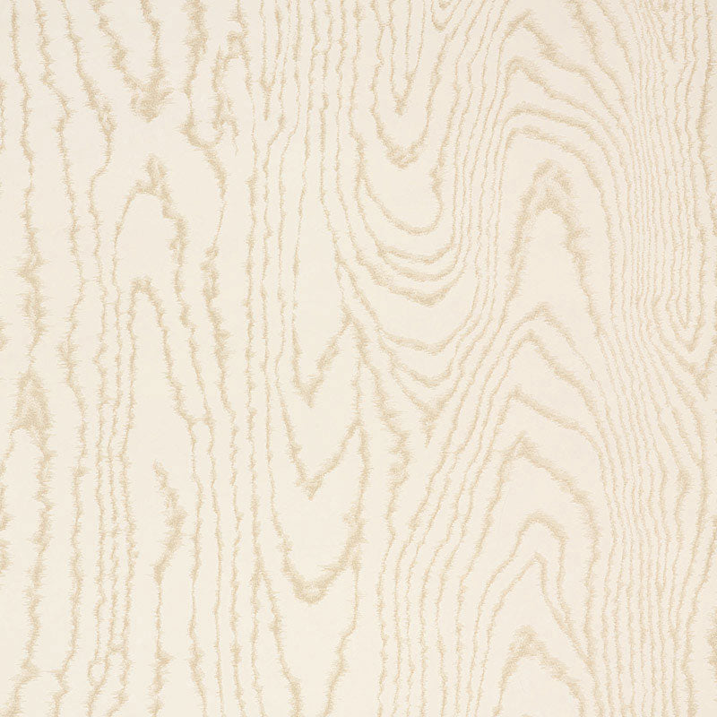 Faux Bois Sand Shimmer wallpaper by Schumacher shown in a stylized wood-grain pattern with a hint of iridescence, installed in a modern dining room.