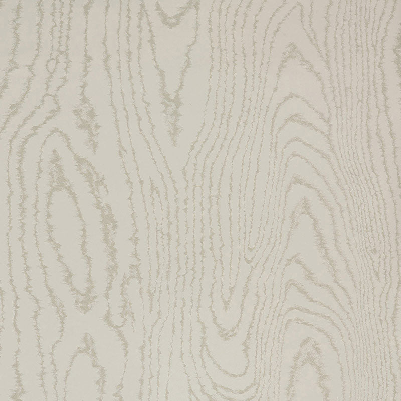 Faux Bois Stone wallpaper by Schumacher shown in a stylized wood-grain pattern, installed in a modern dining room.