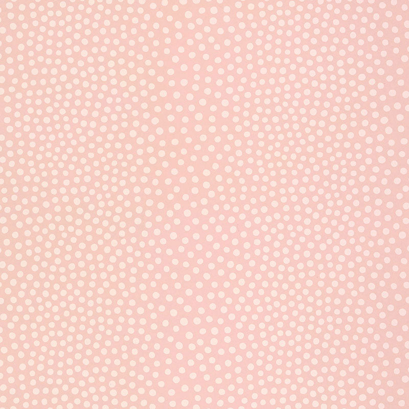 Raindots wallpaper in washed pink with irregular polka dot pattern by Schumacher