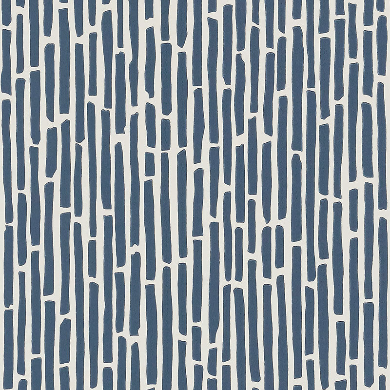 Bamboo Marine wallpaper by Schumacher, a lively and graphic surface-printed wallcovering with a dense bamboo thicket pattern in blue and white.