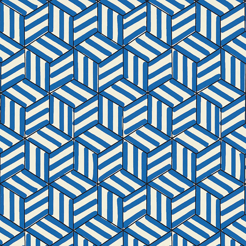 TUMBLING BLOCKS cobalt blue geometric wallpaper by Schumacher shown in various interior settings, including bedroom and bathroom installations.