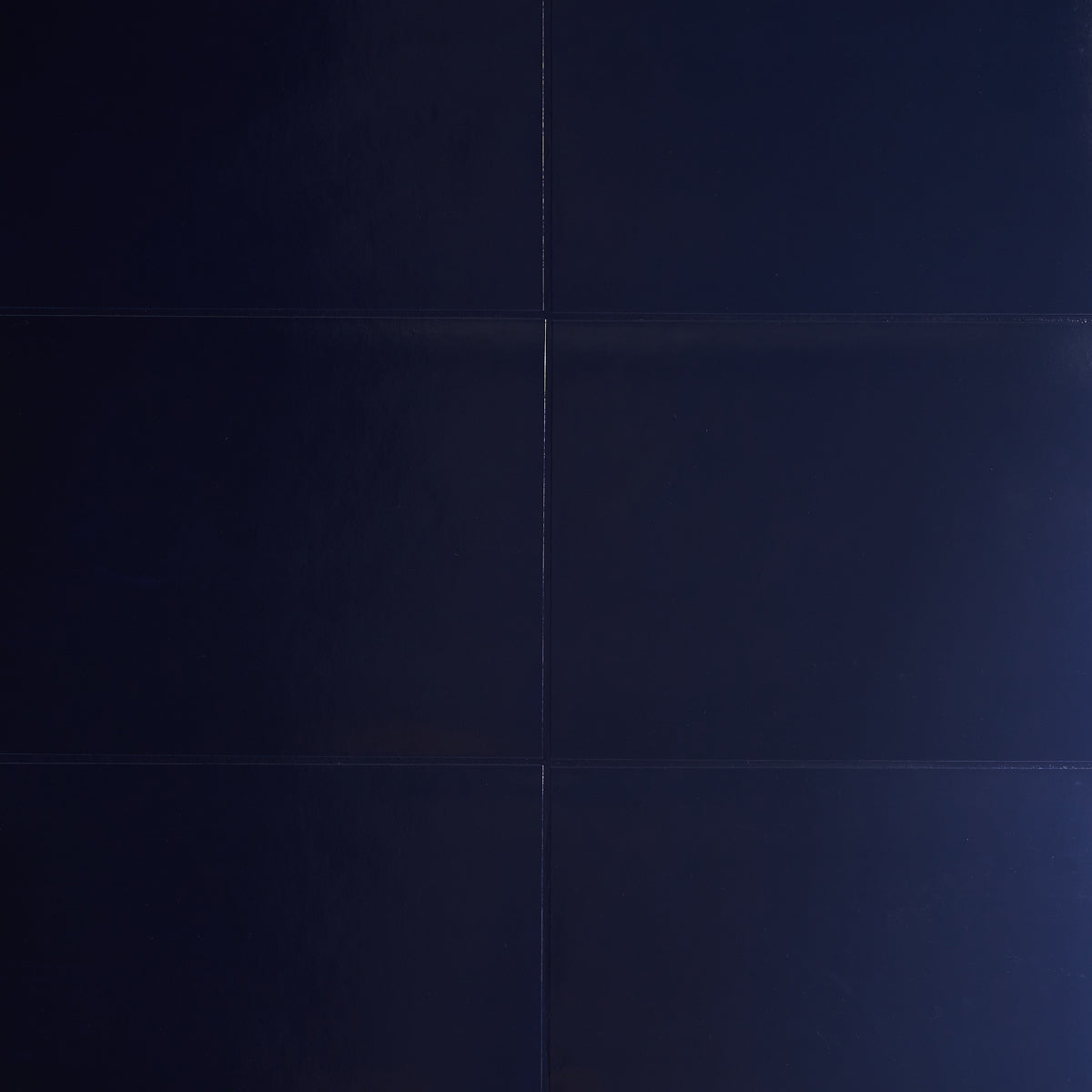 Glossed Vellum navy blue wallcovering with a luxe, luminous finish by Schumacher.