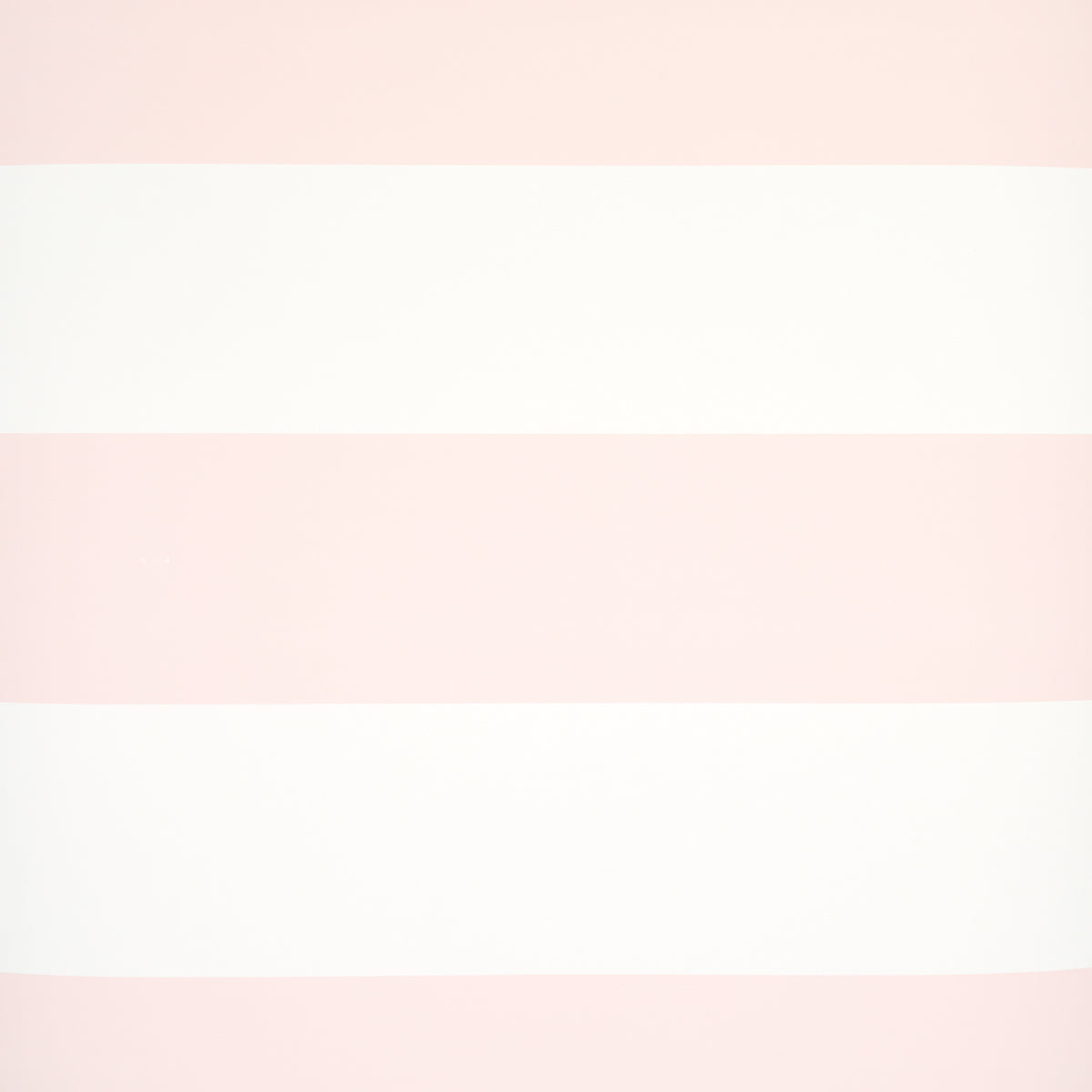 Baxter Stripe wallpaper in blush pink and white horizontal stripes by Schumacher, shown in styled and detail views.