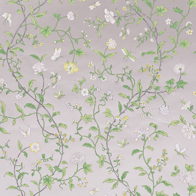 Floraison wallpaper in Citron Shimmer by Schumacher features a delicate, hand screen-printed floral motif with scrolling vines and blossoms.