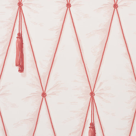Blush pink diamond tufted trompe l'oeil wallpaper with hanging tassels by Schumacher, styled in a bedroom setting.