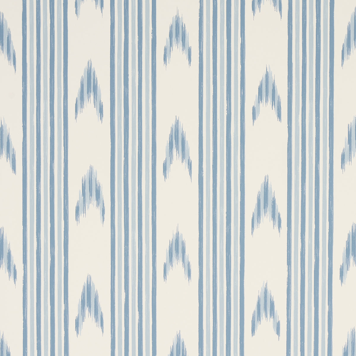 Santa Barbara Ikat wallpaper in China Blue by Schumacher, featuring a blue and white ikat stripe pattern, styled in a kitchen interior.