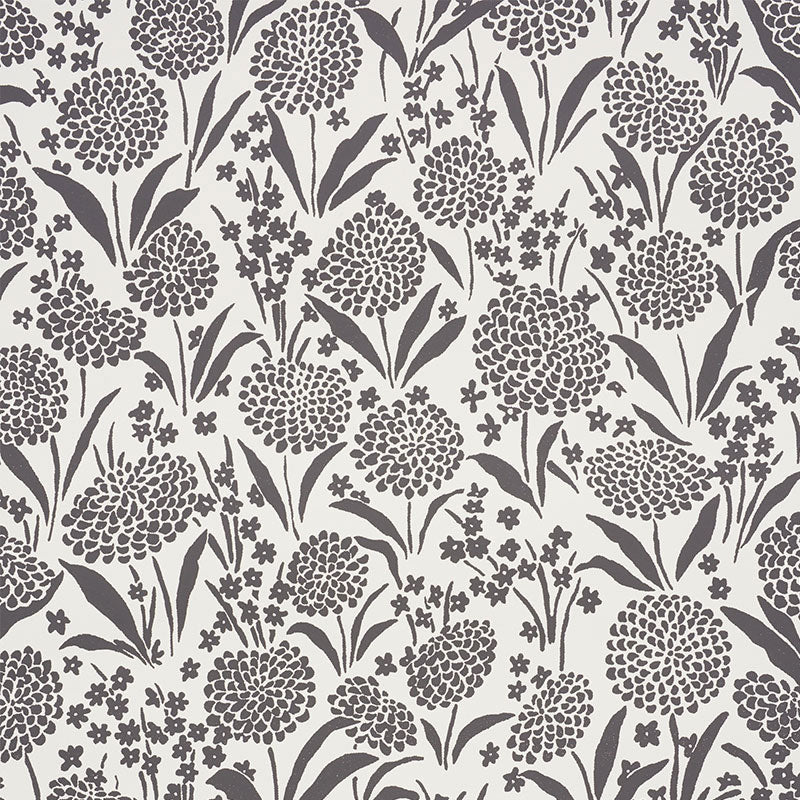 Chrysanthemum Carbon by Schumacher - Small floral print wallpaper in black and white, styled in a bathroom and bedroom setting.