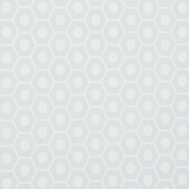Queen B Mineral geometric hexagon wallpaper by Schumacher, shown in a modern interior setting.