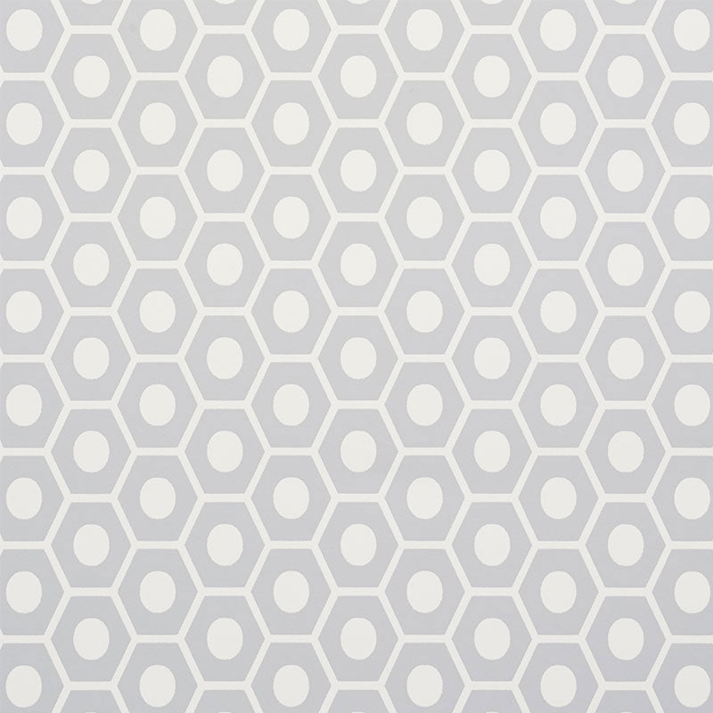 QUEEN B wallpaper in grey by Schumacher, featuring a modern geometric honeycomb pattern.