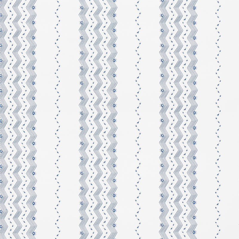 Nauset Stripe Indigo wallpaper by Schumacher, featuring a blue and white zigzag stripe pattern, shown in a modern bedroom setting.