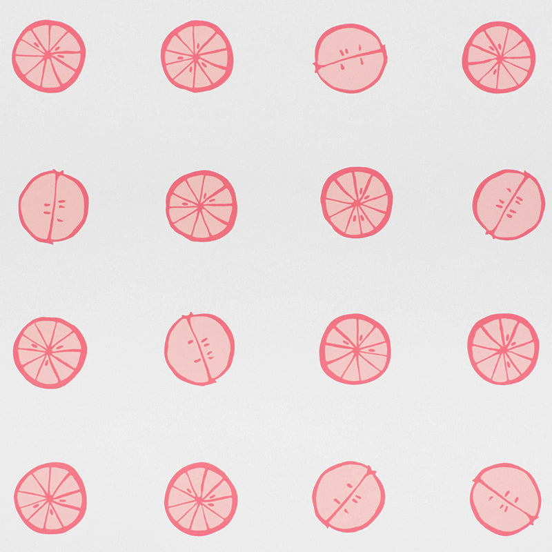 Lemonade wallpaper in Grapefruit by Vera Neumann for Schumacher, featuring whimsical hand-drawn citrus slices in a polka dot pattern.