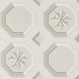 Augustus Stone wallpaper by Schumacher featuring an octagonal grid with faceted stars and floral medallions in a trompe l'oeil style.