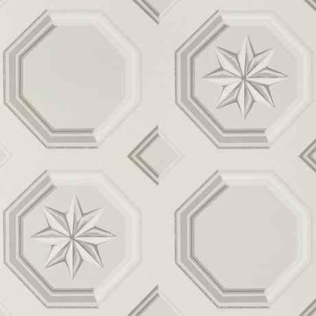 Augustus Stone wallpaper by Schumacher featuring an octagonal grid with faceted stars and floral medallions in a trompe l'oeil style.
