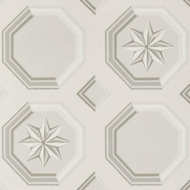 Augustus Stone wallpaper by Schumacher featuring an octagonal grid with faceted stars and floral medallions in a trompe l'oeil style.