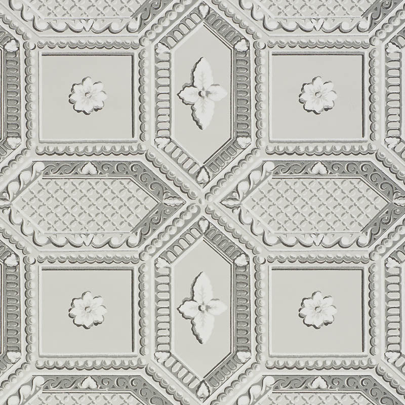 Lacunaria Dove wallpaper by Schumacher features a trompe l'oeil coffered ceiling design with stylized florettes in soft dove gray tones.