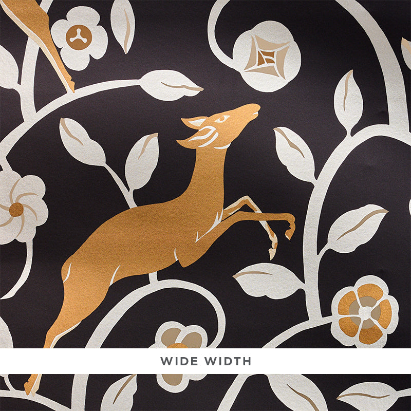 Art Deco style wallpaper featuring leaping gazelles and foliage in gold and cream on a noir (black) background, Les Gazelles au Bois by Schumacher.