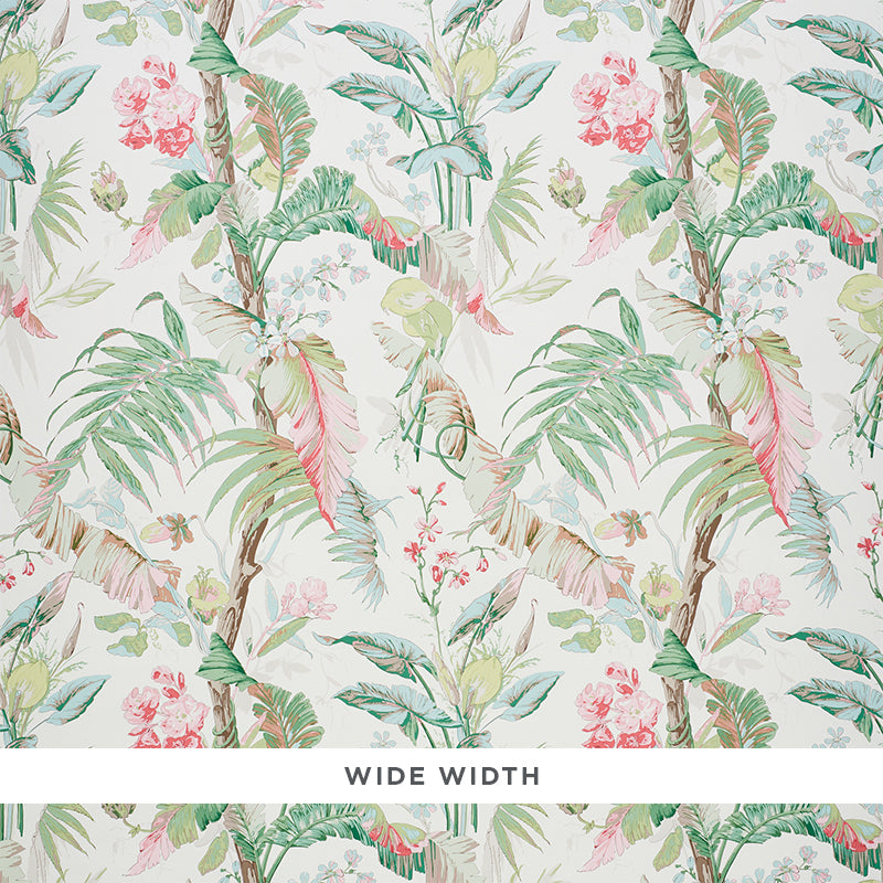 Tropique Blush by Schumacher - painterly tropical botanical wallpaper with interwoven blossoms, leaves, and branches in blush and green.
