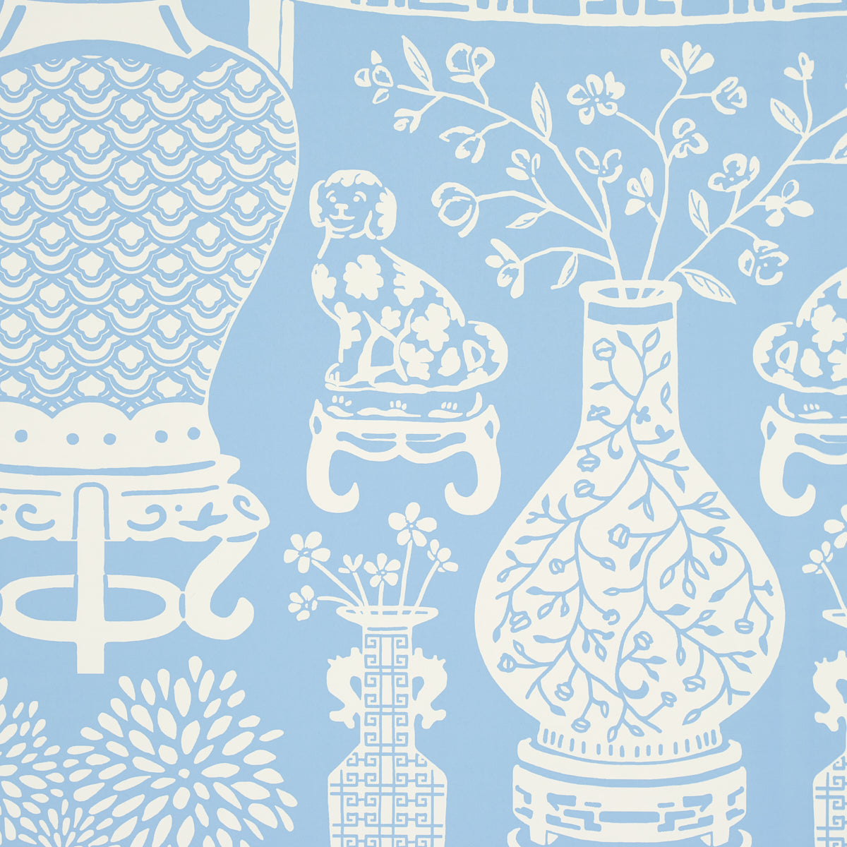Hellene wallpaper in Sky by Schumacher featuring Ming vases and Staffordshire dogs in a mirrored pattern on a blue background.
