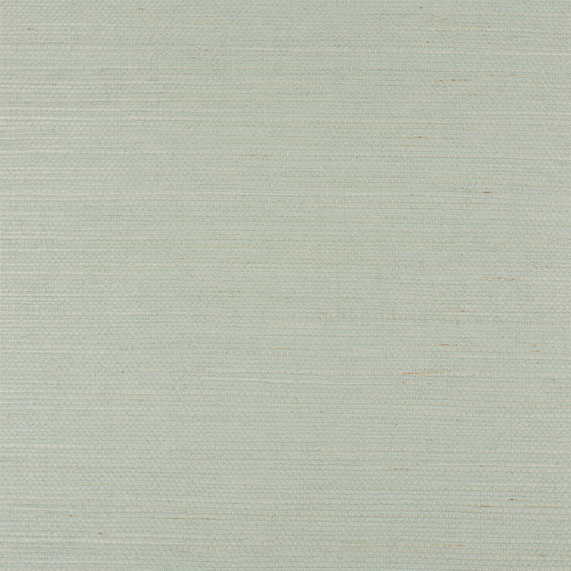 Haruki Sisal Aloe grasscloth wallpaper by Schumacher shown in close-up and styled in a modern interior setting.