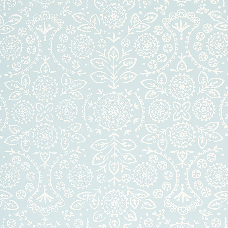 TIANA Sky by Schumacher - Bohemia Collection, screen-printed wallcovering with large mirrored repeat in soft blue and white embroidery effect.