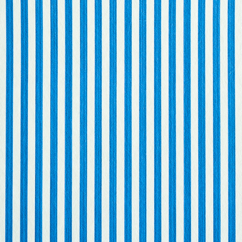 Edwin Stripe Narrow wallpaper in cobalt blue and white, featuring narrow vertical stripes for a classic, dimensional look.