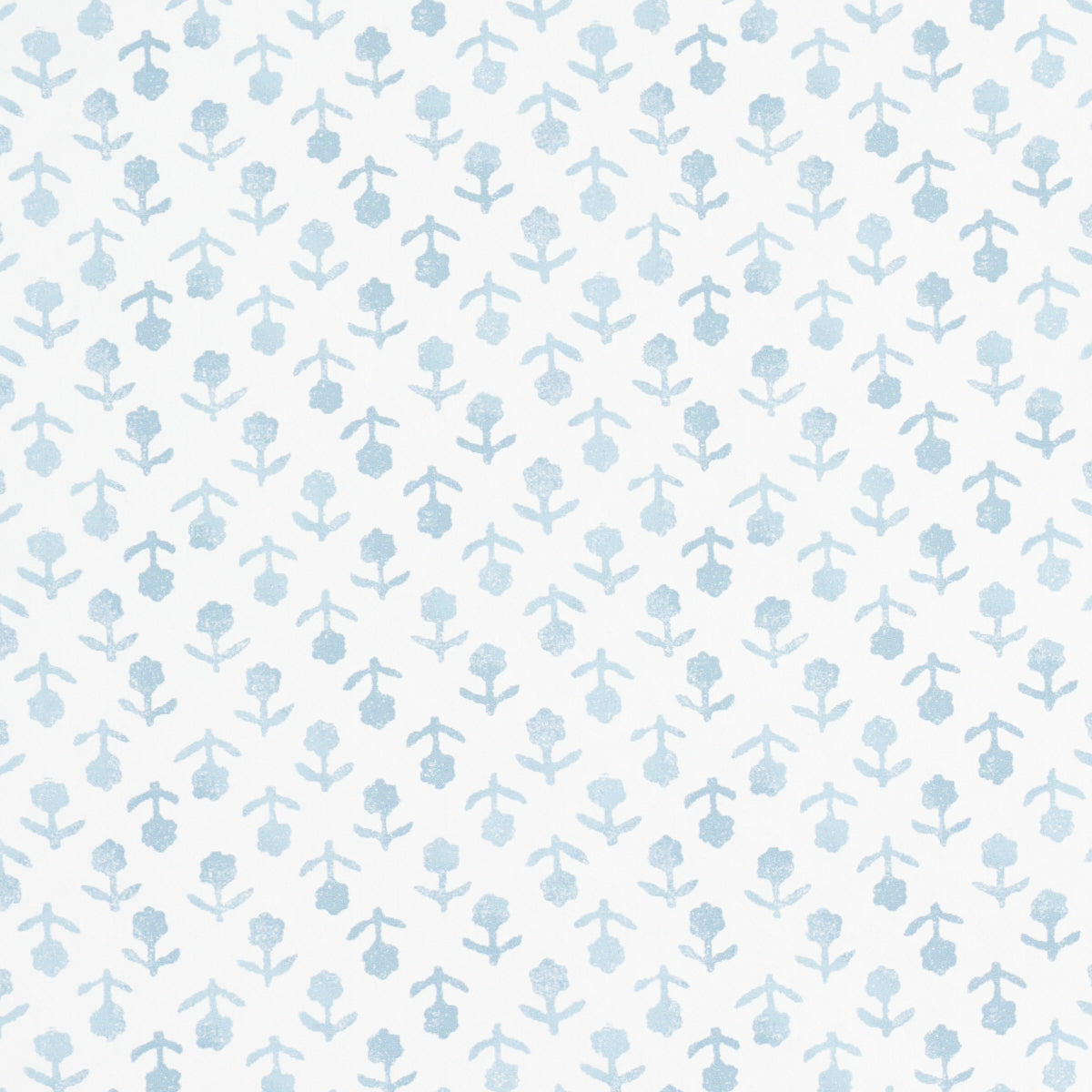 Beatriz Sky by Schumacher, a delicate blue floral wallpaper inspired by indigo resist-dye techniques, shown in a bathroom interior and as a roll.
