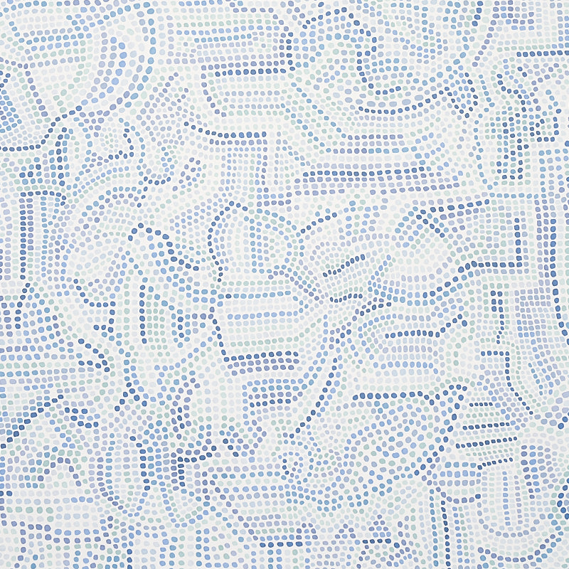 Galina wallpaper by Schumacher features a mosaic of abstract blue shapes reminiscent of antique tiles, shown in a modern bedroom setting.