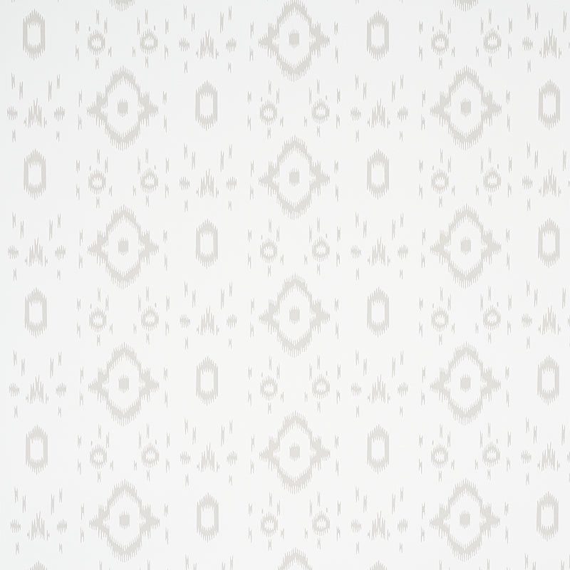 Tabitha Soft Grey by Schumacher - a subtle ikat-inspired geometric wallpaper in a light neutral colorway, shown in a bathroom setting.