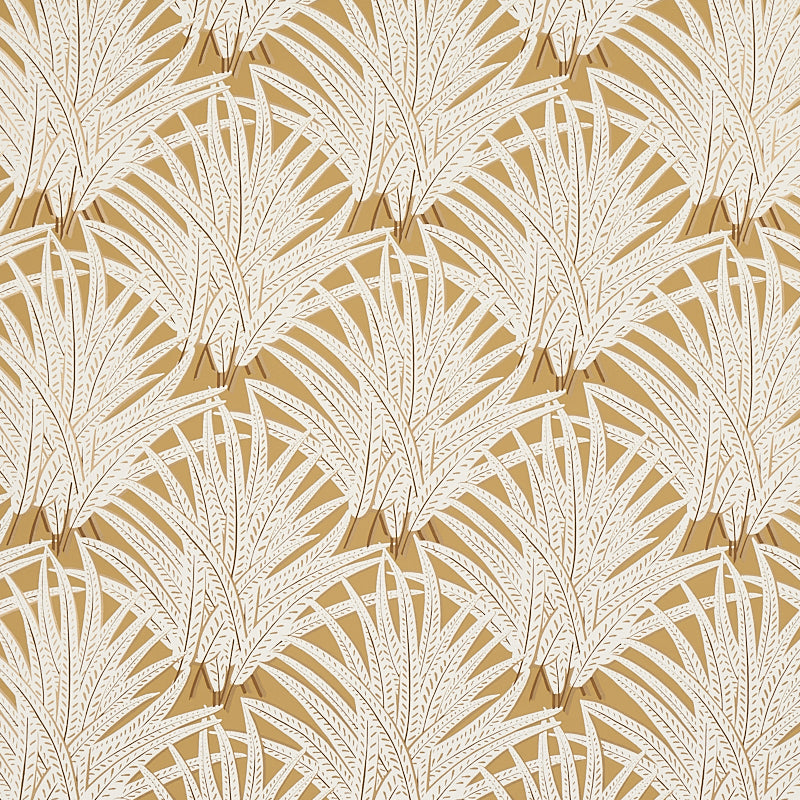Zenada gold wallpaper from Schumacher's Copacabana collection featuring a botanical palm leaf pattern in white on a gold background.