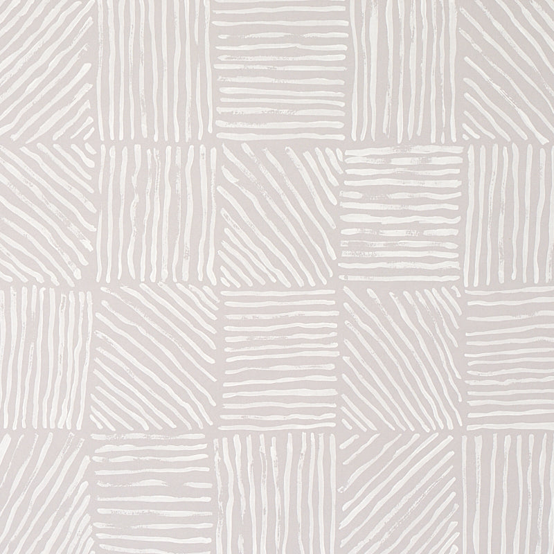 Katama wallpaper by Caroline Z Hurley for Schumacher, featuring an ivory-on-stone linear block pattern with artistic brushwork.