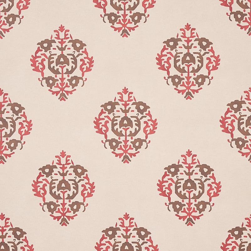 Constantine wallpaper in Jasper by Schumacher, featuring a stylized block print-inspired damask pattern in red and brown tones on a neutral background.