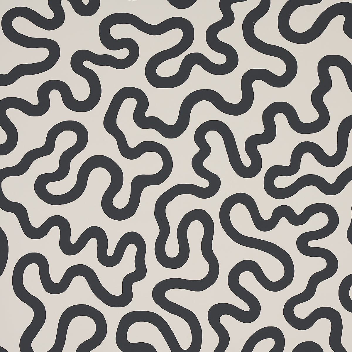 RILEY Soft Black abstract squiggle wallpaper by Schumacher, shown in a modern interior setting.