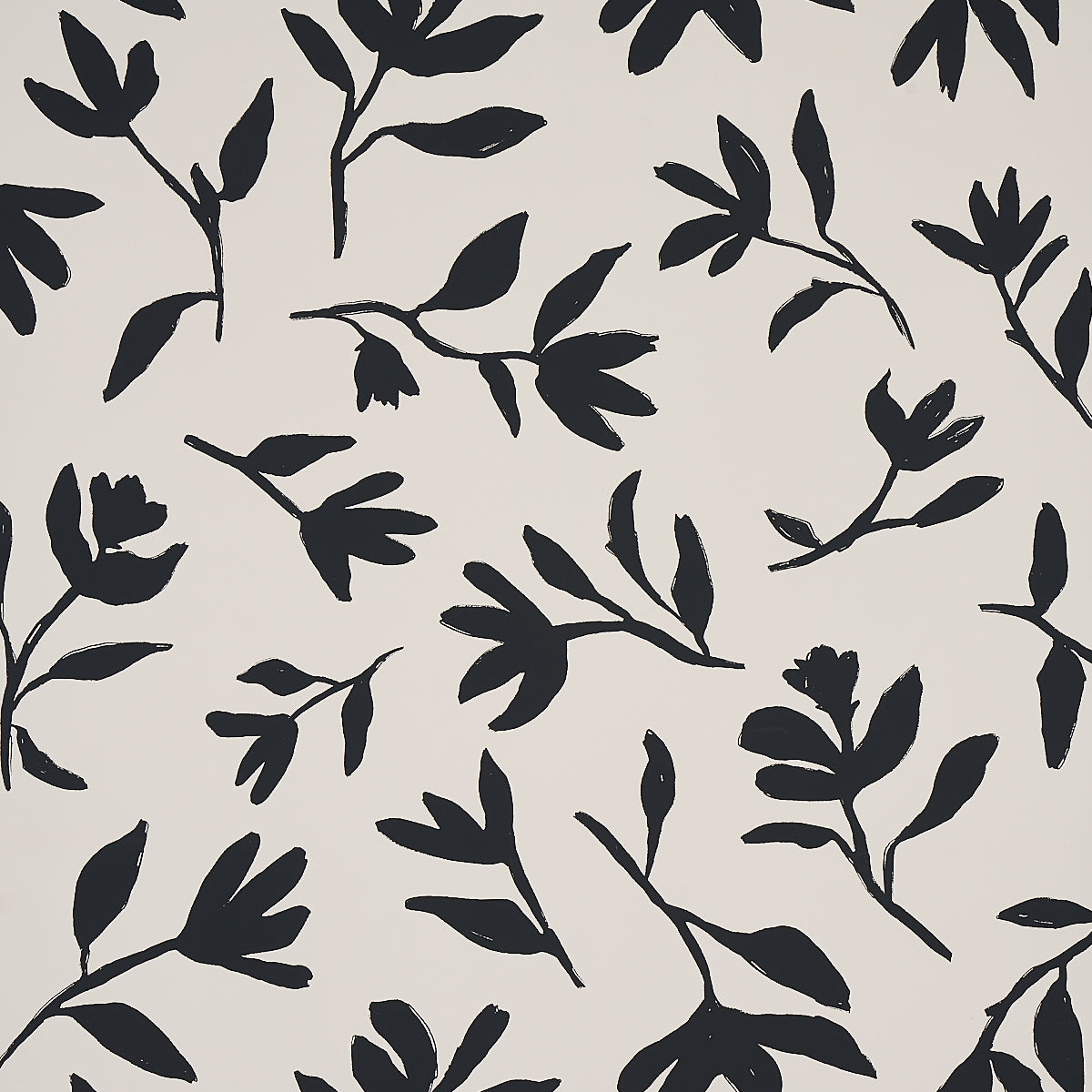 Laurel wallpaper in black by Schumacher, featuring bold hand-drawn botanical silhouettes on a light background.