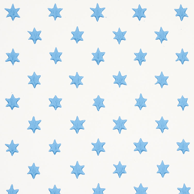 Astral blue wallpaper by Schumacher featuring small six-pointed stars in a repeating pattern, designed by Hobe Erwin.