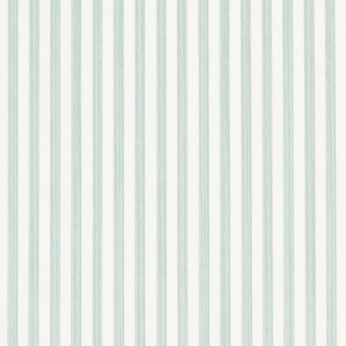 Edwin Stripe Narrow wallpaper in Eucalyptus by Schumacher, featuring narrow vertical stripes in soft green and white.